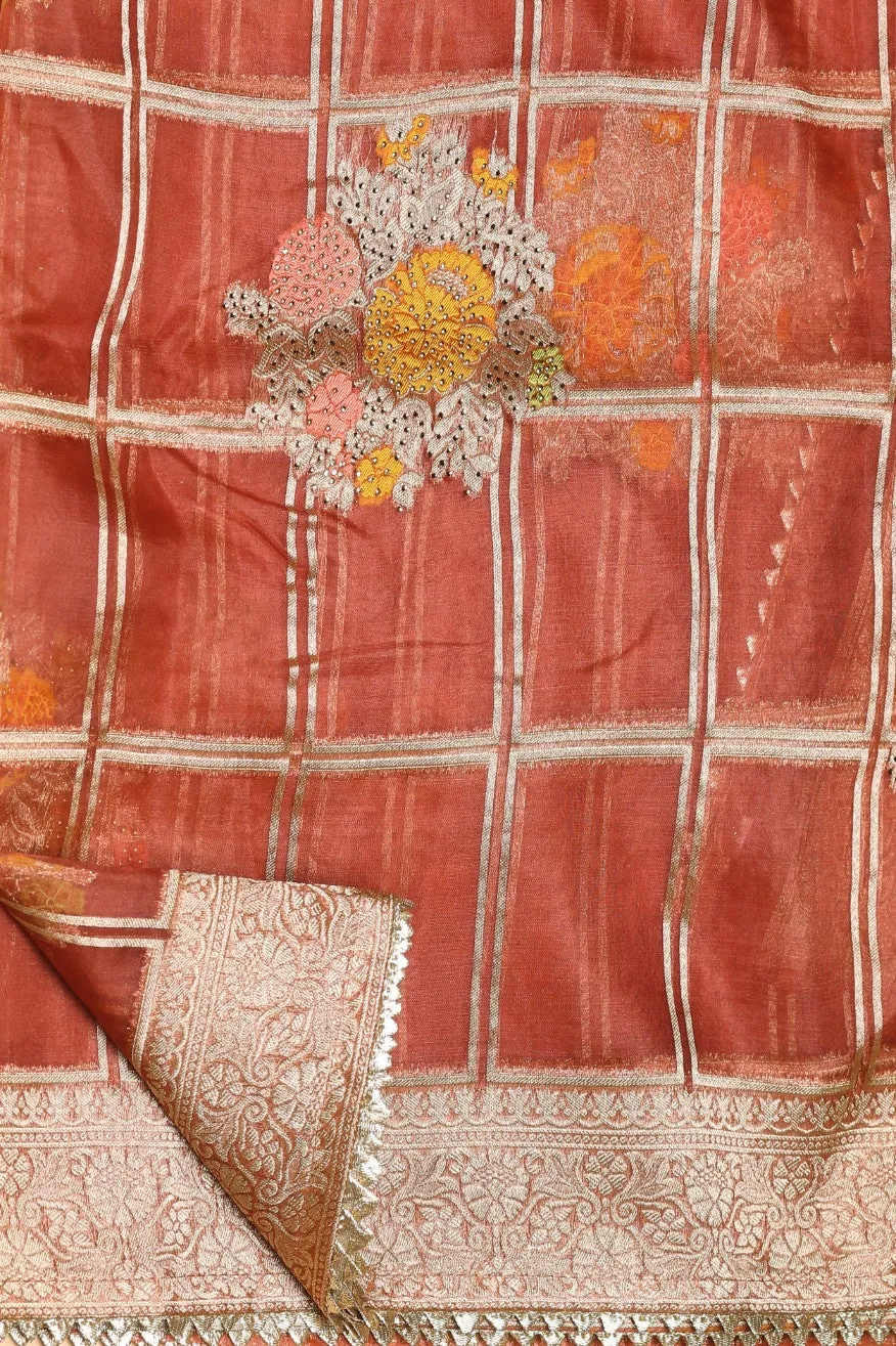 Beautiful rust orange color floral motif highlighted saree