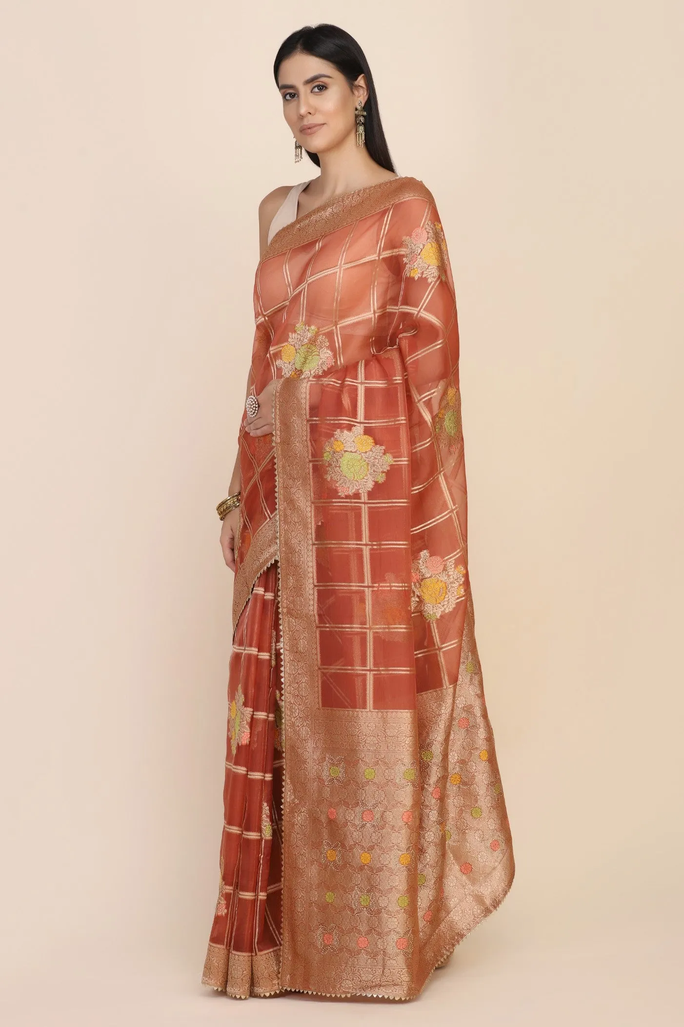 Beautiful rust orange color floral motif highlighted saree
